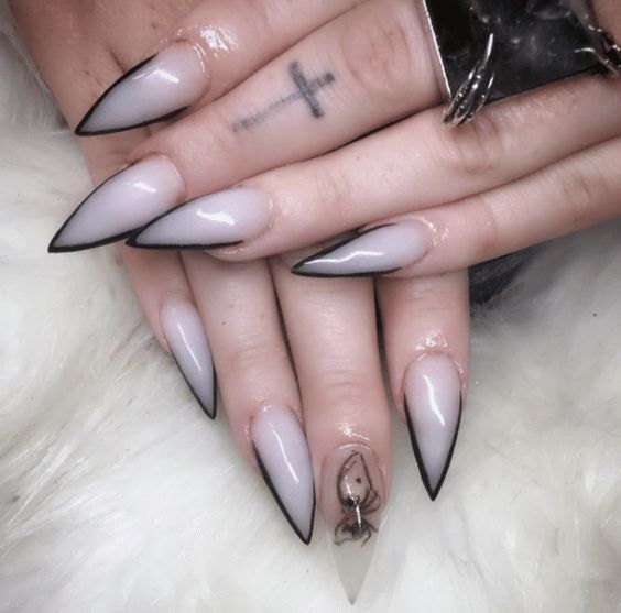 Witch and Nun Halloween Nail art, with black and white triangle french tip design  