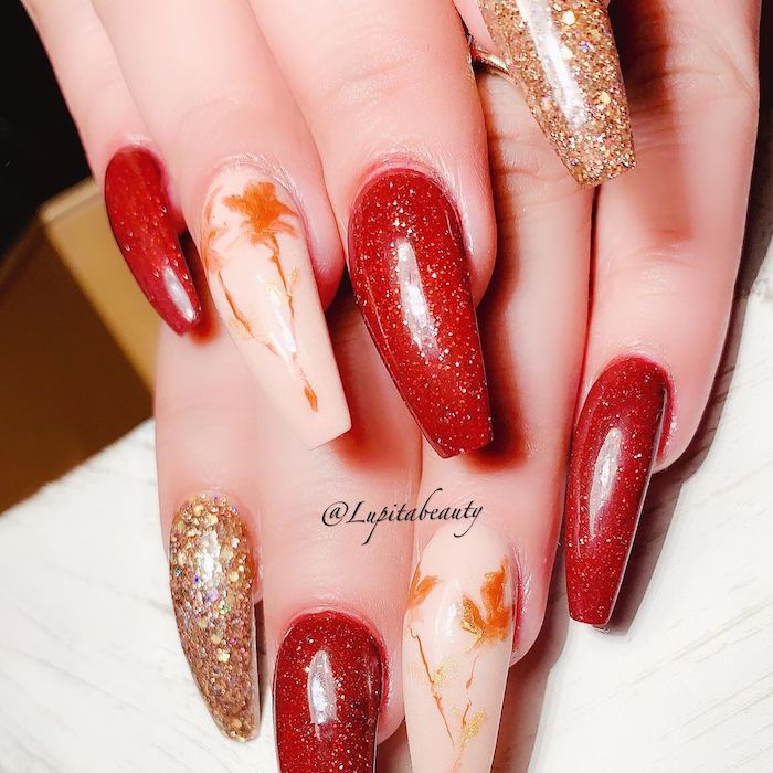 Red, white, and gold glitter with floral design long coffin classy nails for fall.