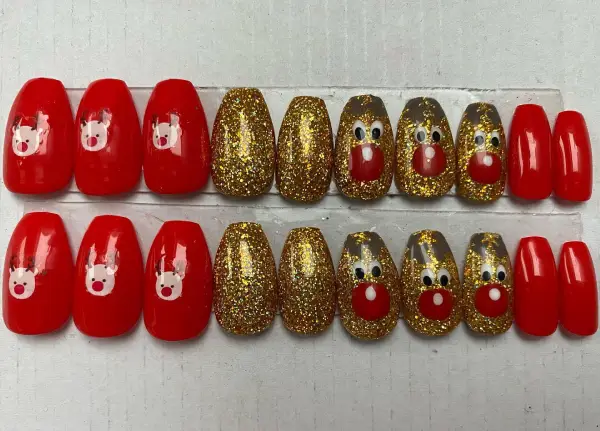 red and gold festive reindeer nails 