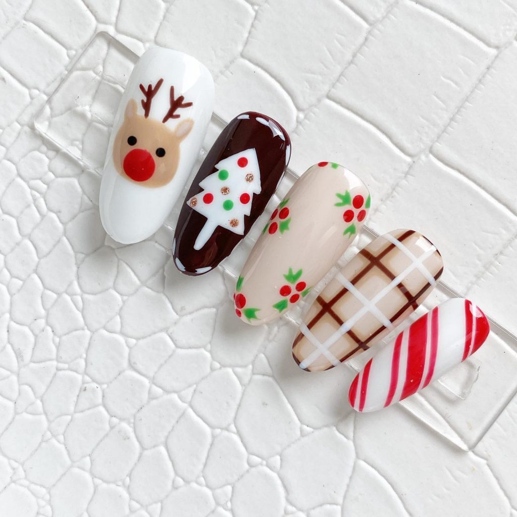 Oval Short Christmas tree reindeer checkered and Candy cane nail design ideas