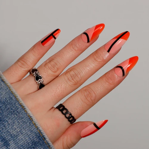 Black and bright orange design oval shape nails