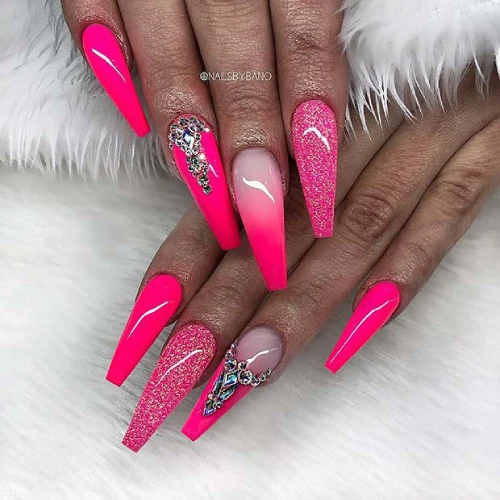 Bright and light pink hot long Coffin nails with Diamond design and glitter ombre nail polish look